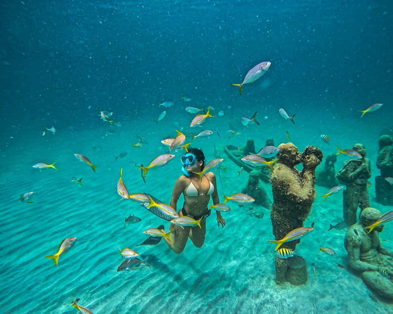 Girl surrounded by fish