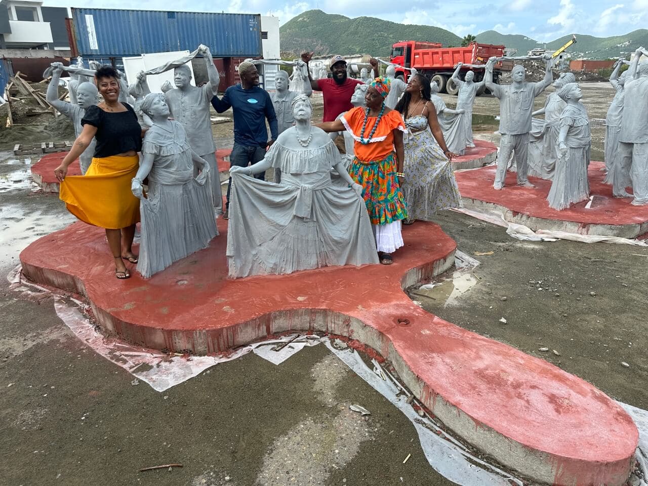 St Maarten local community posing with their statues
